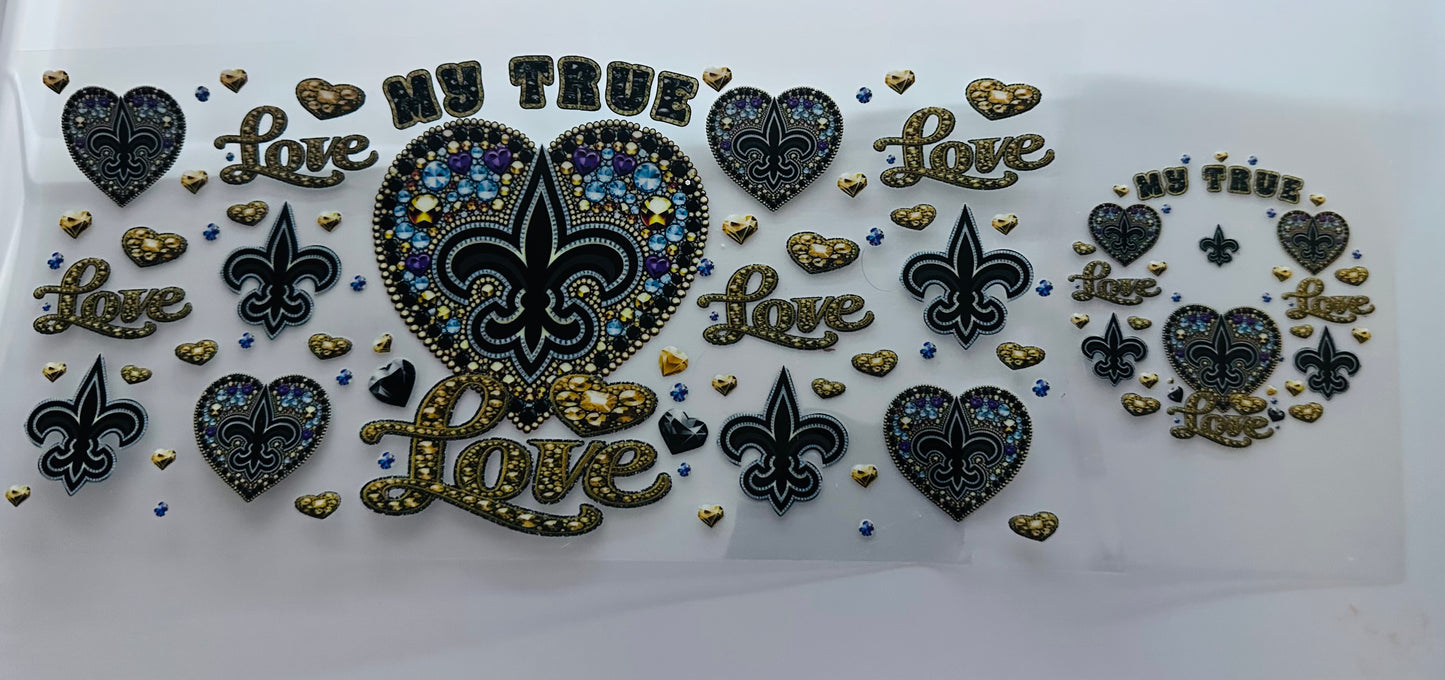 A decorative sticker with a black background featuring multicolored hearts, stars, and text that reads 'My True Love' and 'Love'.