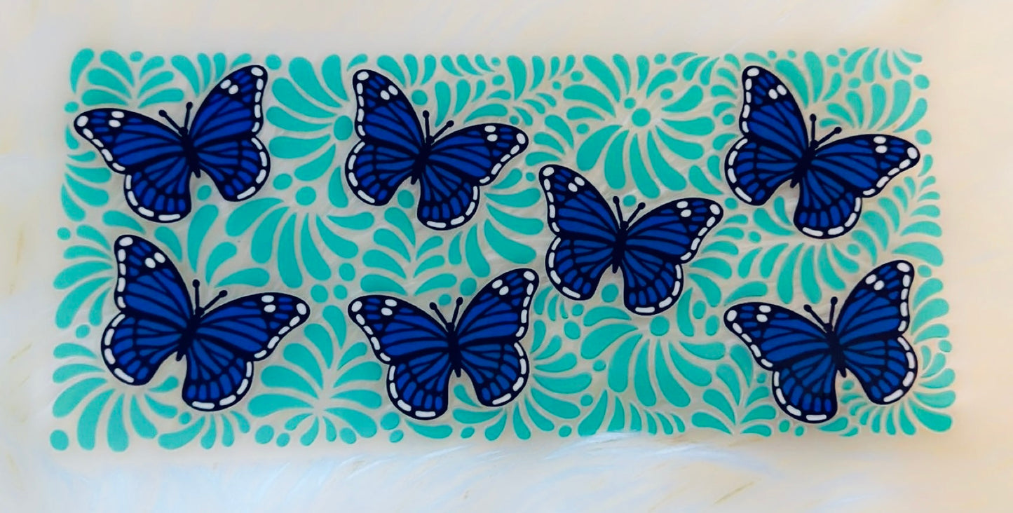 Blue butterflies and teal background