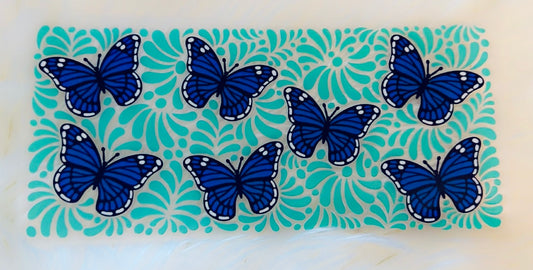 Blue butterflies and teal background